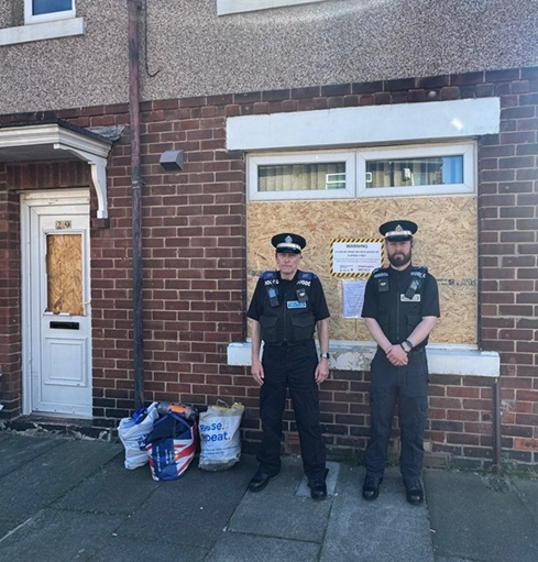 Community officers standing outside 29 Byron street