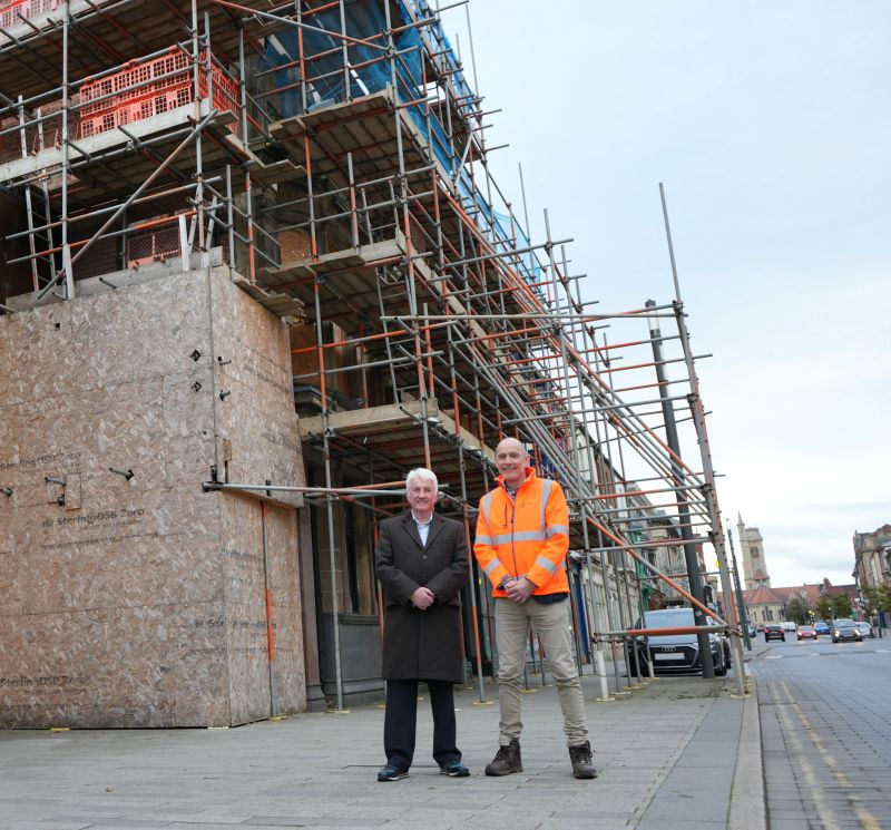 Cllr Rob Darby and Construction worker on Church Street outside building getting refurbished