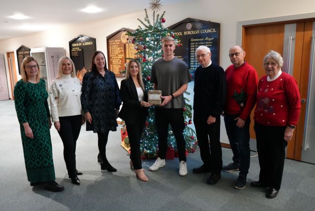 Councillor Melanie Morley (centre) is presented with the gift vouchers by St George’s Church United Reformed Church and Grange Road Methodist Church members and friends Ryan Ford, Ray Trench, Paul Rodgers and Katie Bosworth