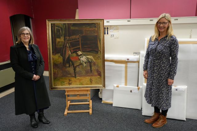 Councillor Karen Oliver (left) and Angela Thomas pictured with John Wilson McCracken’s painting ‘The Chair’ together with other artworks already packed for shipping to Two Temple Place for the exhibition