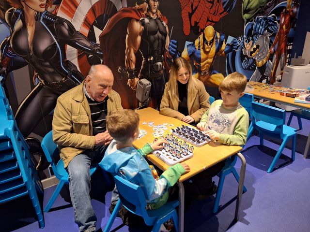 Councillor Melanie Morley and Councillor Moss Boddy, Vice-Chair of the Council’s Children’s Services Committee, join youngsters for a board game at one of Hartlepool Holiday Fun’s Christmas activity sessions