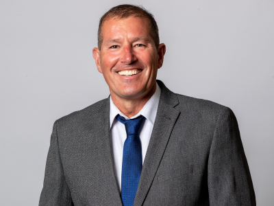 Headshot David bruce councillor in grey suit jacket, white shirt and blue tie