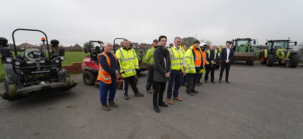 Councillor Owen Riddle, front, with members of the grass cutting and weed management teams.