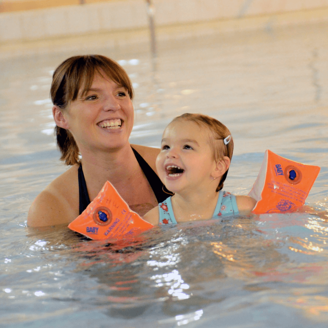 Mother and daughter in swimming pool