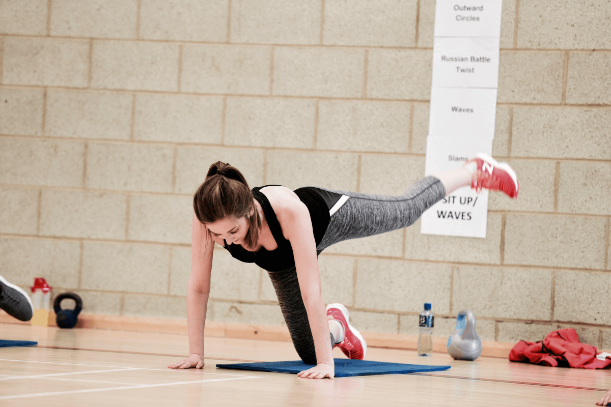 Lady stretching within a class