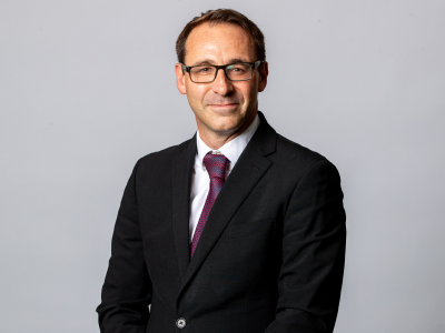 Headshot Martin scarborough councillor in black suit jacket, white shirt and maroon tie