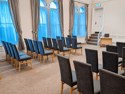 neutral decorated room with floor to ceiling windows