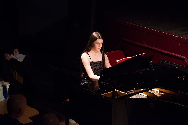Applicant performing piano onstage