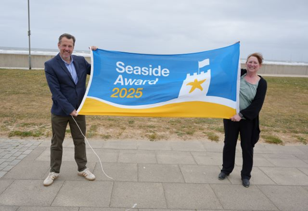 Councillor Gary Allen and Debbie Kershaw, the Council’s Quality and Safety Officer, prepare to raise the Seaside Award flag at Seaton Carew