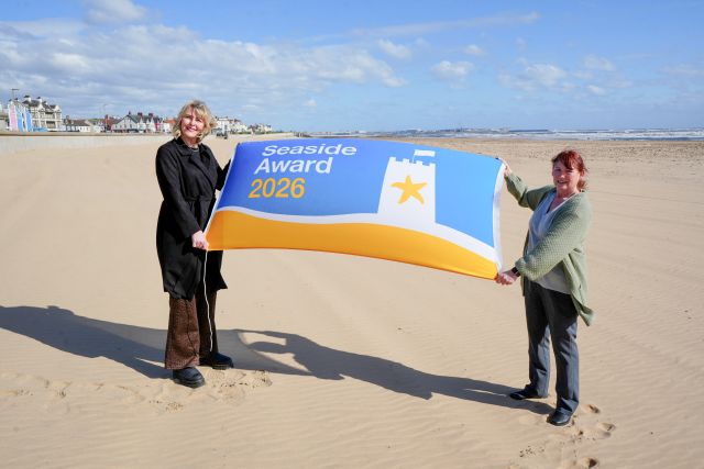 Gemma Ptak (left) and Debbie Kershaw, the Council’s Quality and Safety Officer, prepare to raise the Seaside Award flag at Seaton Carew