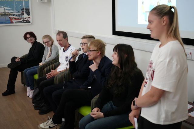 Some of the supported interns and volunteers took to the stage to host a question-and-answer session: (l. to r.) Noah Hunter, Leah Maughan, David Boyd, Mitchell Jenkins, Tom Collins, Emily Sudron plus event compere Olivia Kerr-Morgan