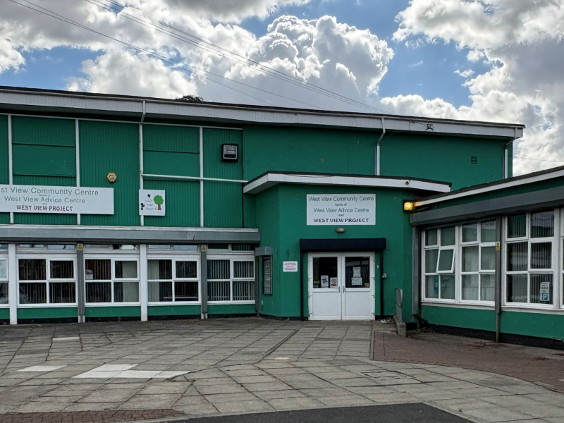West View Advice and Resource Centre external front of the building. Green building with white doors and windows.