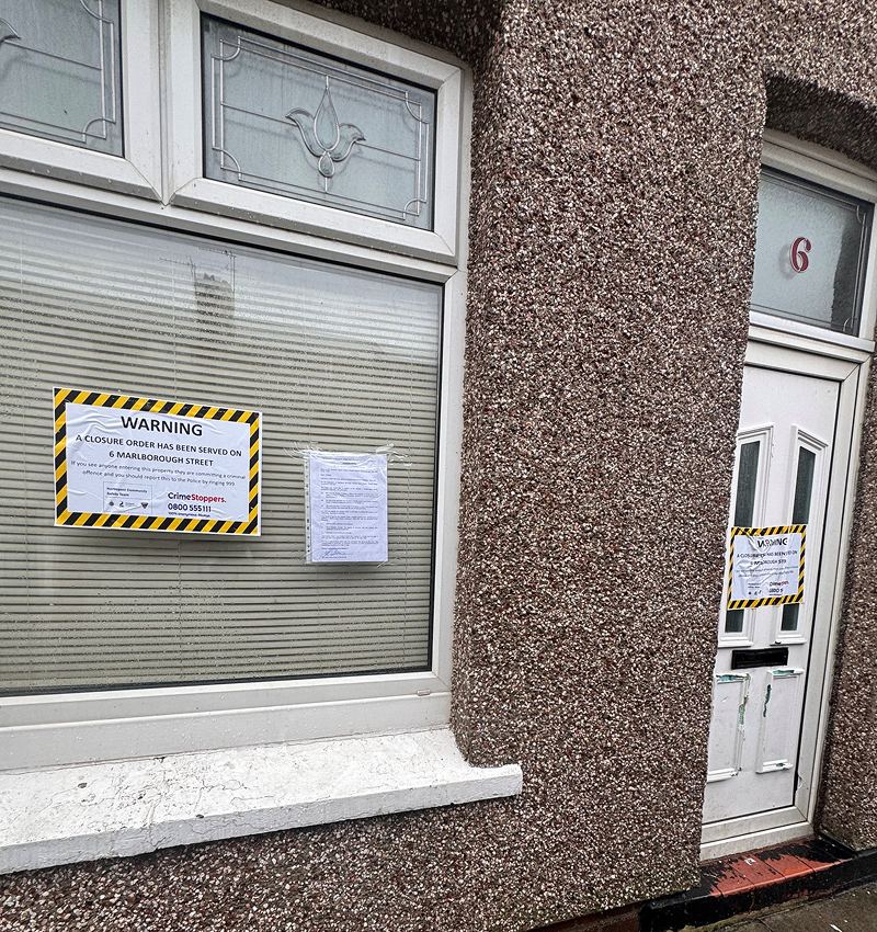 House on Malborough Street with notice in window